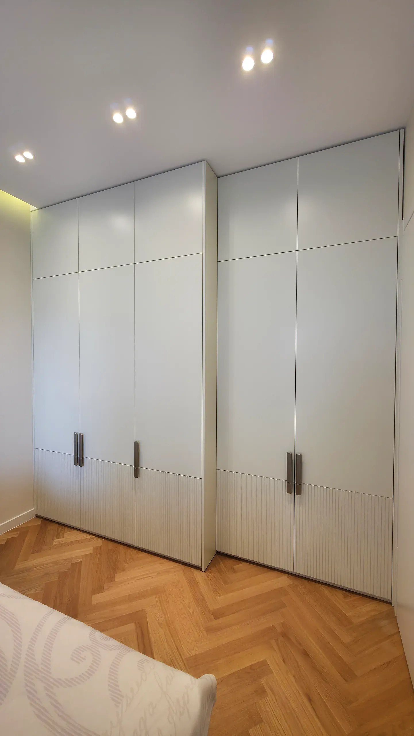Floor-to-ceiling handleless wardrobe in a bedroom — Futurium project in Arki Saburtalo